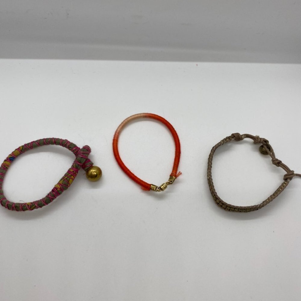 Lot of three gold tone hardware bracelets